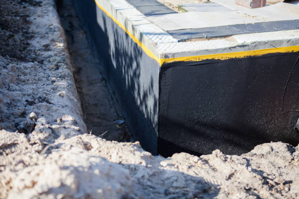 Professional Waterproofing technician working in Swanton, OH